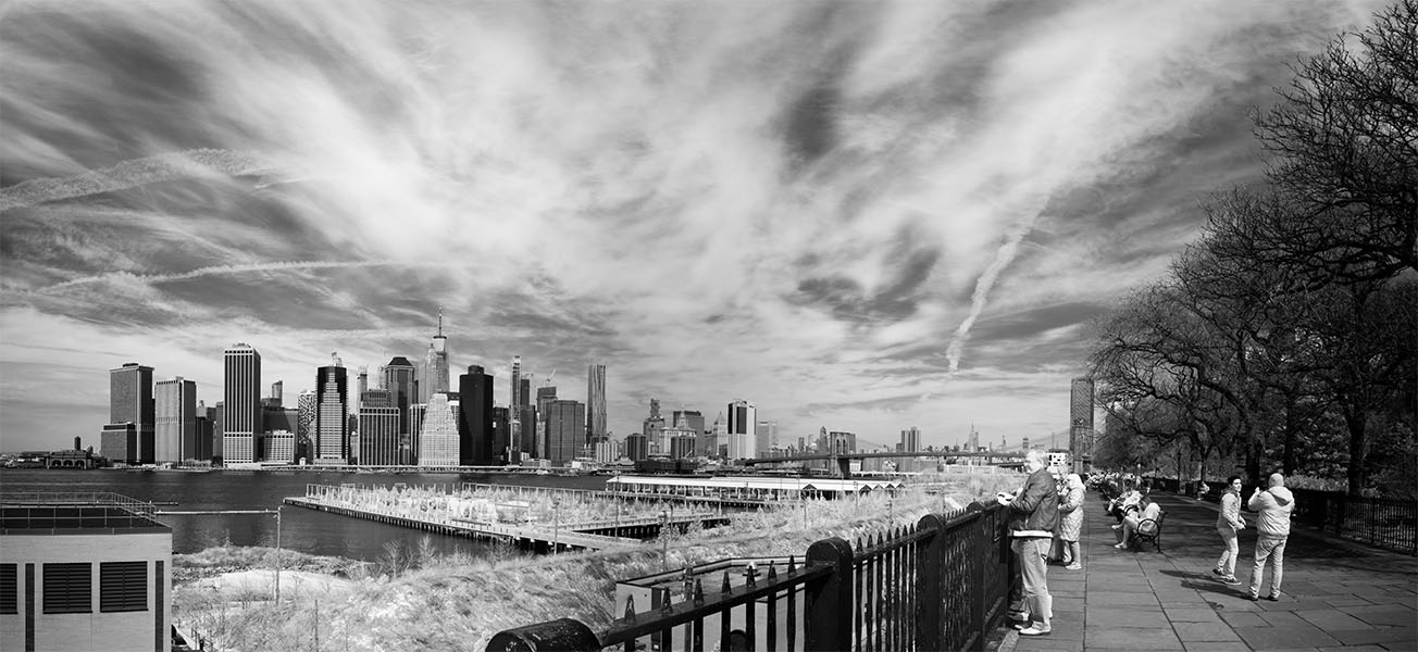 Infrared Panoramic Photograph of Manhattan and the Brooklyn Heights Promenade With People Enjoying the Space and View.